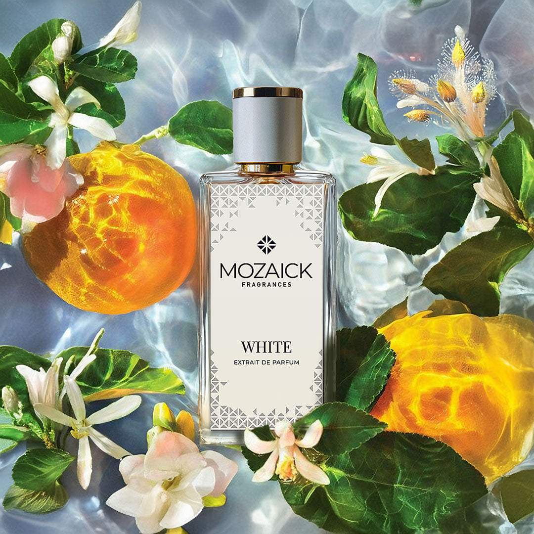 WHITE Extrait de Parfum 50 ml by MOZAICK – bottle in water with citrus fruit, leaves and white blossoms